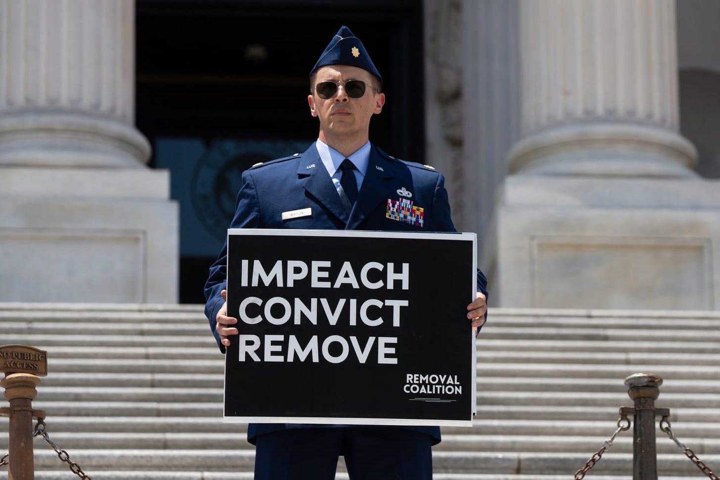 Air Force officer arrested after calling for Trump's impeachment at Capitol