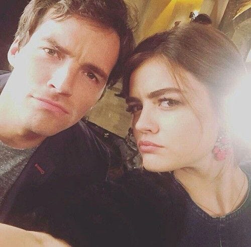 This may contain: a man and woman taking a selfie together
