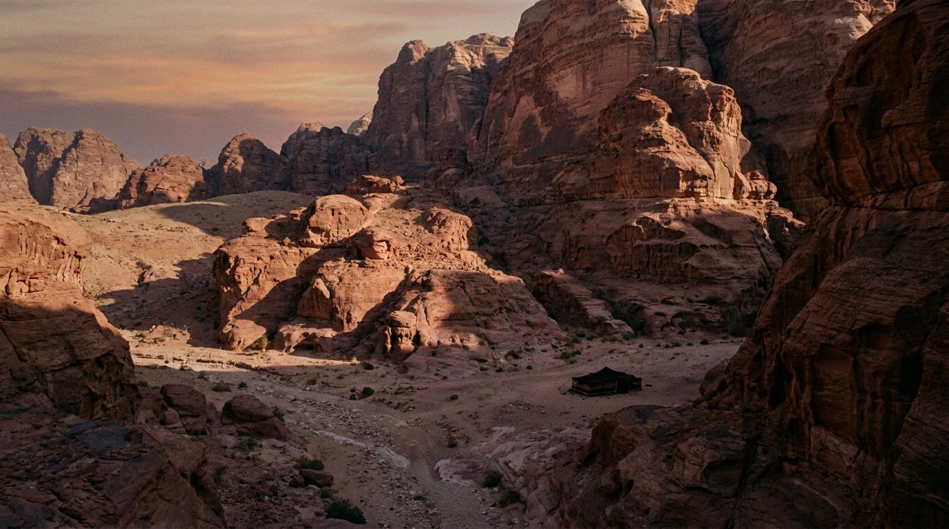 Red sandstone cliffs of Edom at dusk above a dry wadi, a single dark tent far below, long shadows across the stone, no people, no text