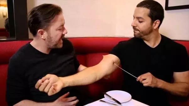 How does David Blane stick a needle through his arm without any blood  coming out? - Quora