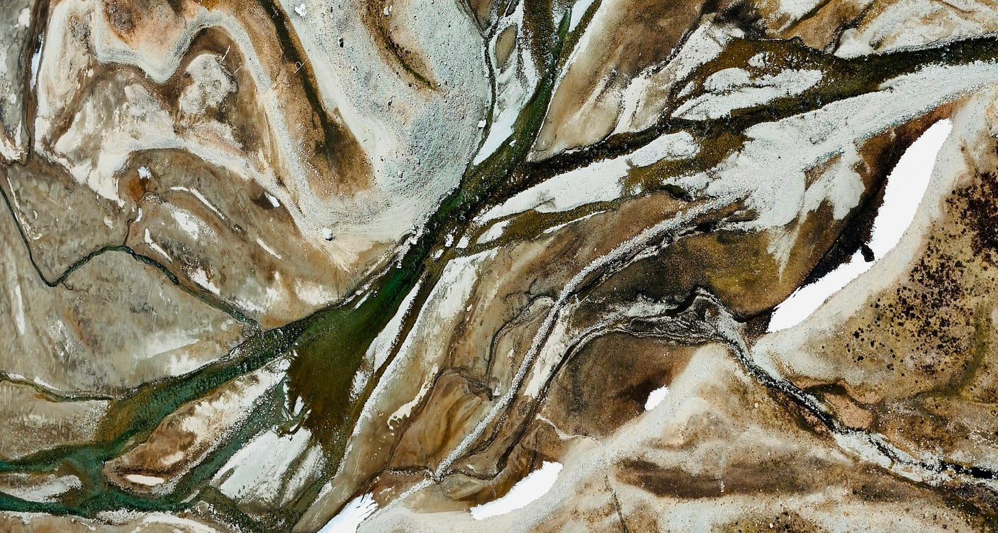 Aerial view of a river delta with branching streams