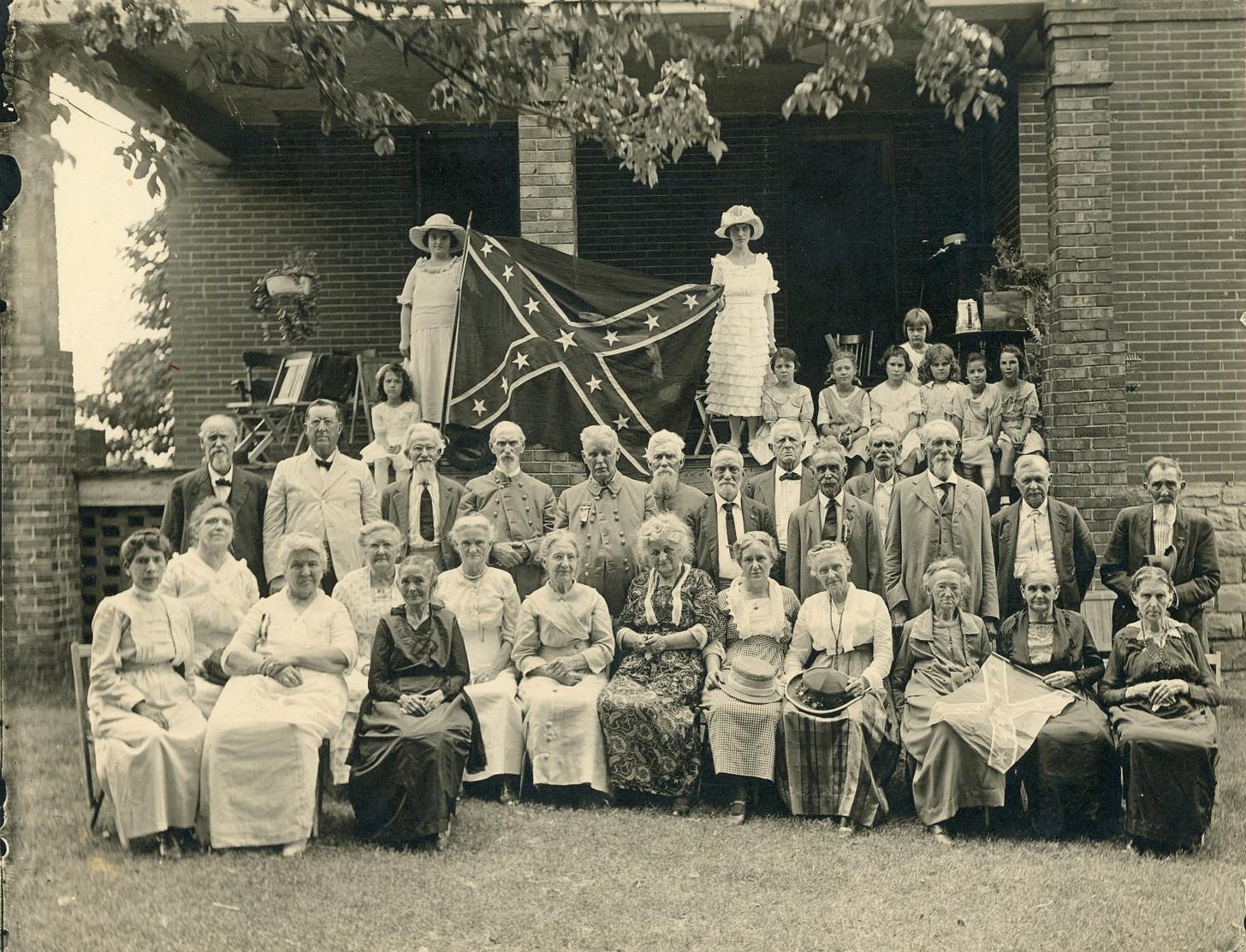 A group of people posing for a photo

Description automatically generated