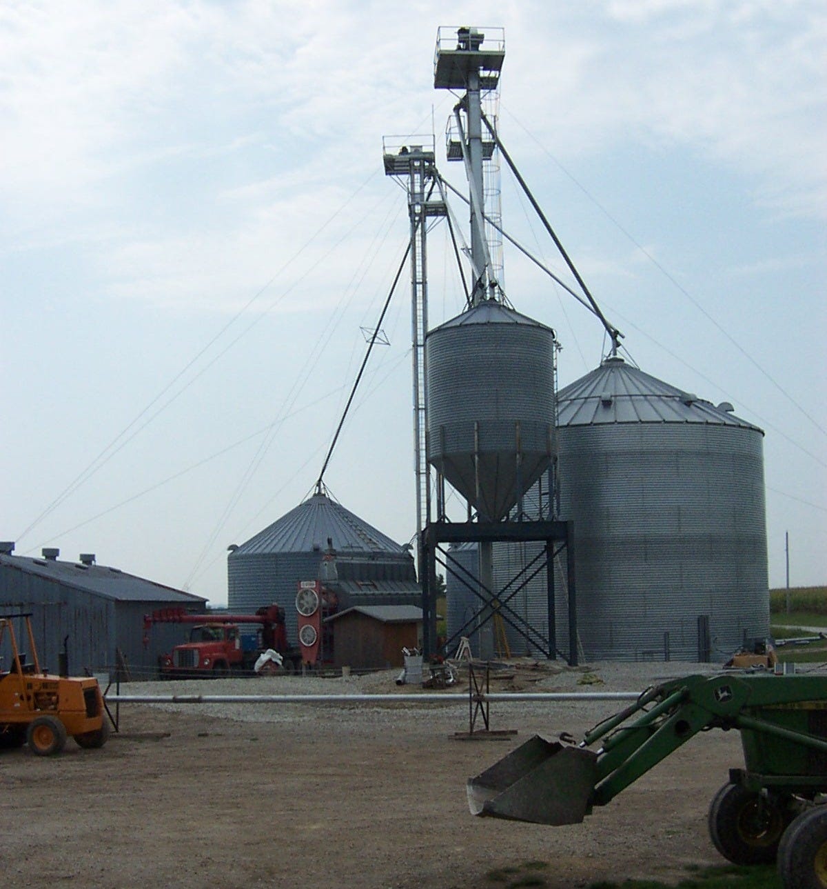 Tall grain bins are the perfect place for farms to put up repeaters to extend coverage across multiple farm tracts. Most grain bins are between 80 and 100 feet tall, allowing good coverage options for repeaters on either VHF or UHF. | Photo from National Communications Magazine archives