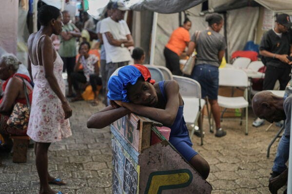 First deportees arrive in troubled Haiti after TPS ends | AP News