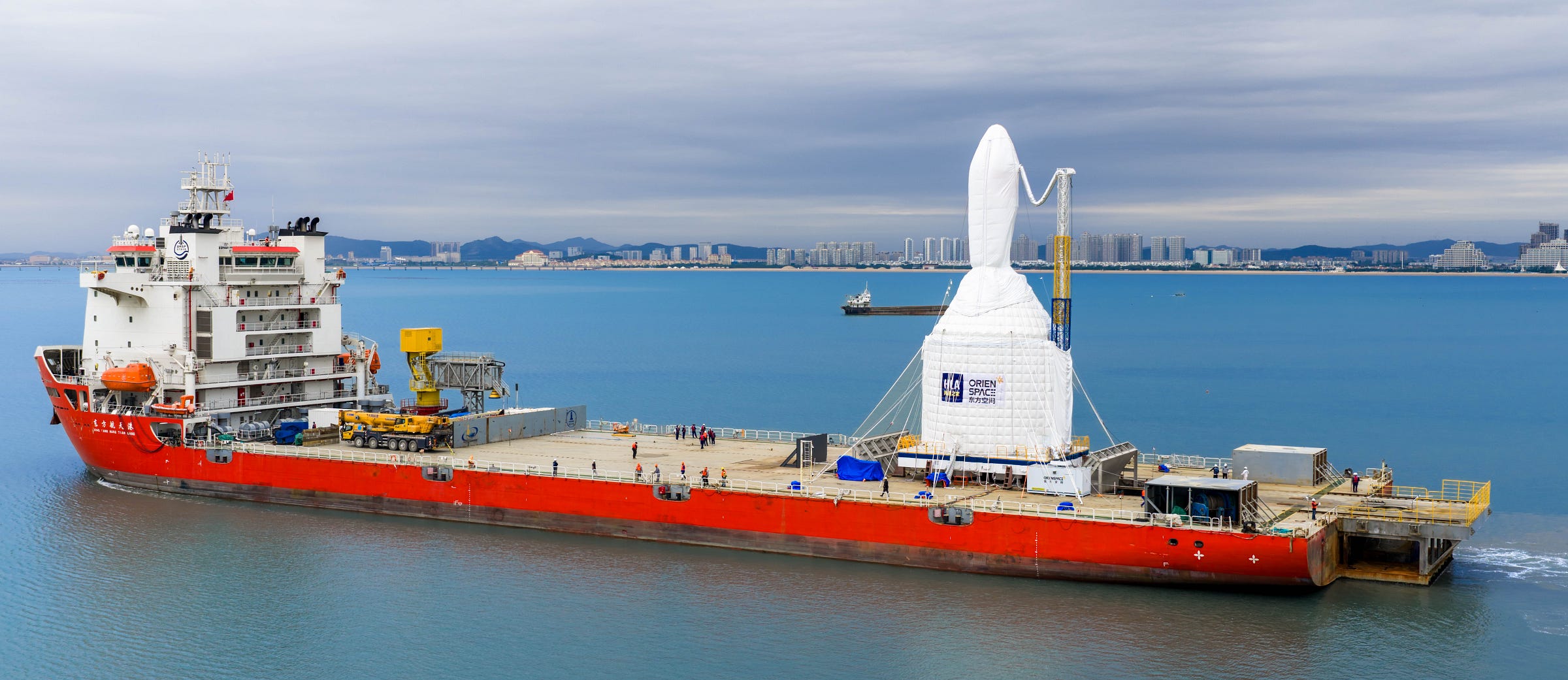 The Gravity-1 Y2 vehicle heading toward its launch location atop of its sea-launch platform as it travels away from Haiyang. The Gravity-1 Y2 vehicle heading toward its launch location atop of its sea-launch platform as it travels away from Haiyang.