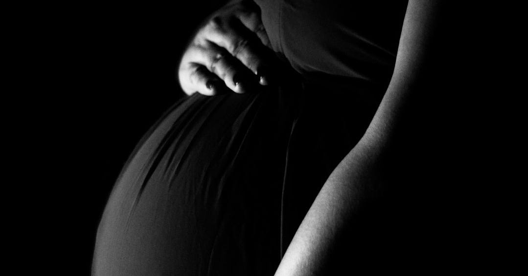 a man holding his head a man holding his head