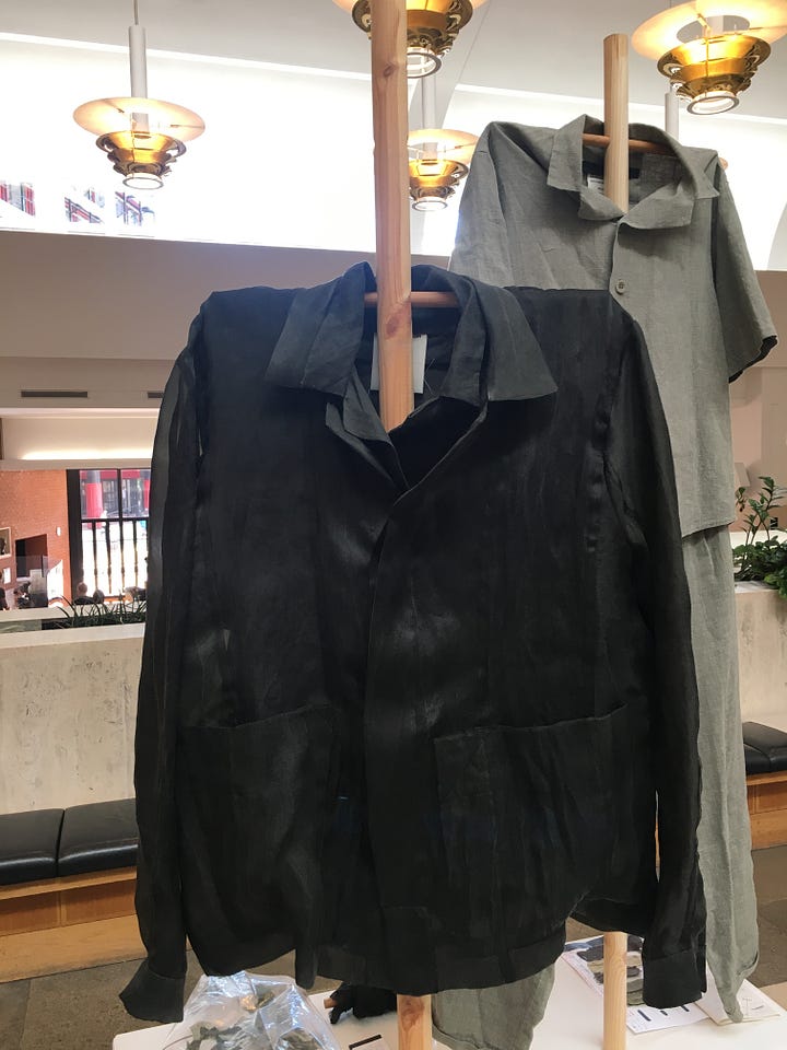 Photos showing natural dyeing experimentation, with sheets of samples with various fibre and fabric types, and two garment examples from the Phoebe English studio.