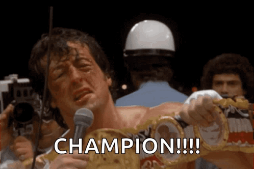 a man is holding a boxing ring and says champion a man is holding a boxing ring and says champion