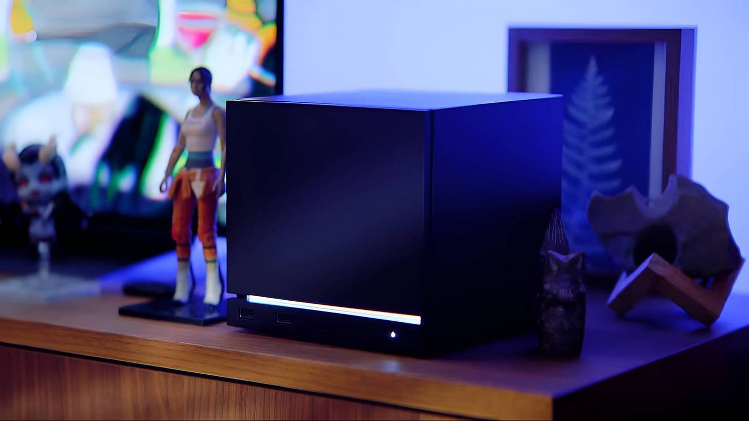 Valve Steam Machine 2026 cube console next to controller on TV stand