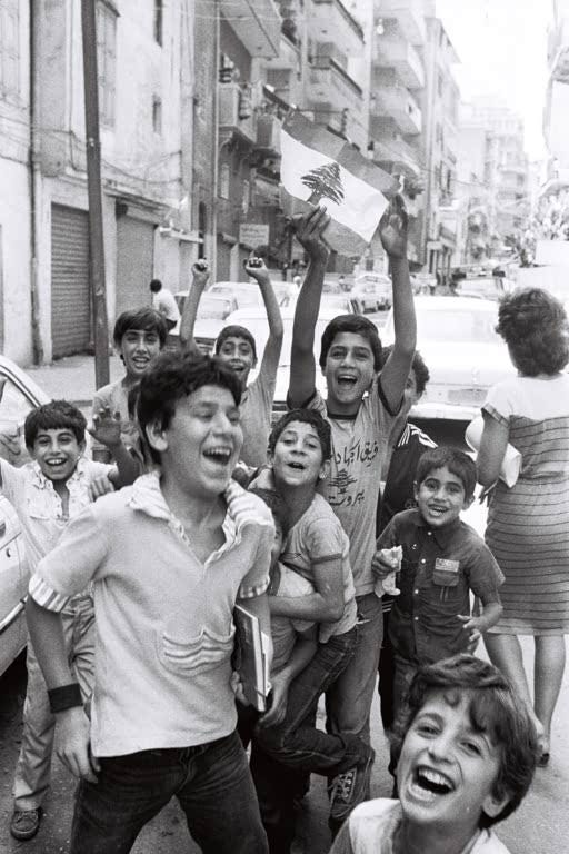 Local children in West Beirut watch with a mix of excitement and apprehension as IDF soldiers march through on September 17, 1982.