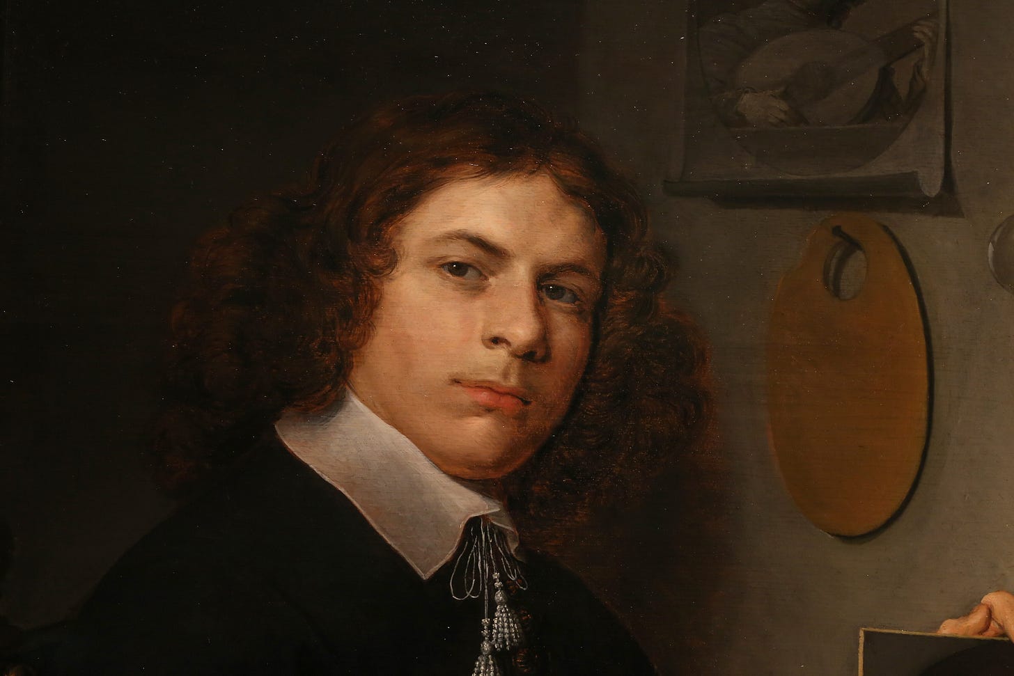 A painter surrounded by a skull, portraits and bubbles A painter surrounded by a skull, portraits and bubbles