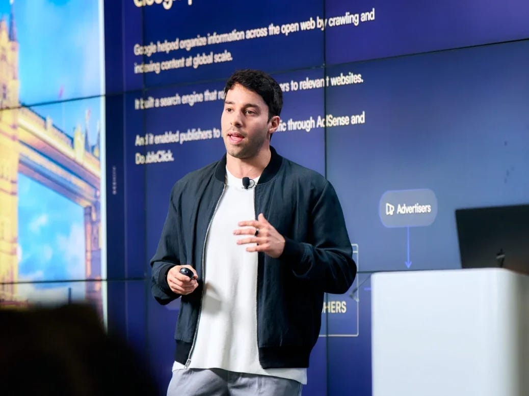 Beehiiv CEO and co-founder Tyler Denk giving a presentation with text on a slide behind him. Discusses newsletter market in 2026