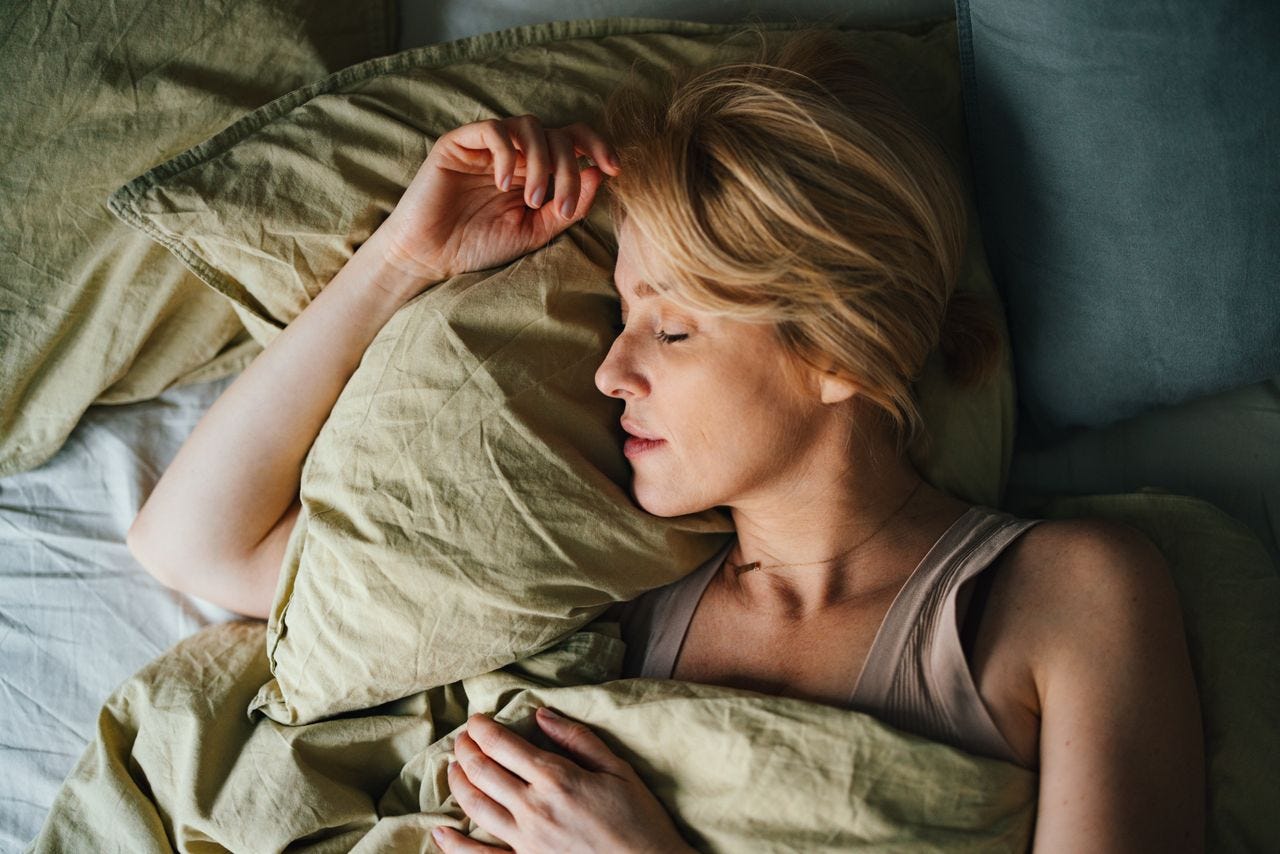 Woman sleeping soundly in bed