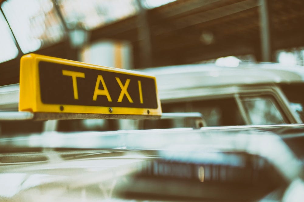 black and yellow Taxi signage black and yellow Taxi signage