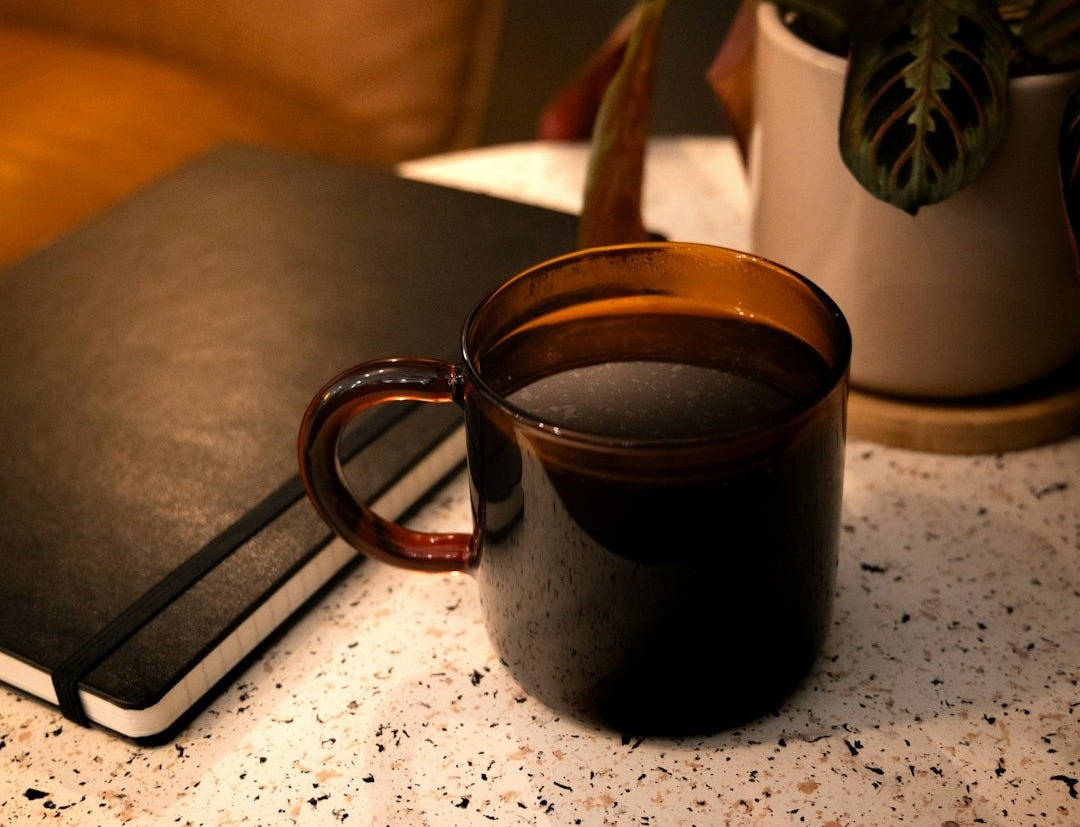 a book and a cup on a table