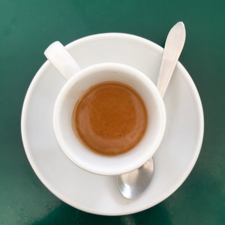 coffee cup on green table coffee cup on green table