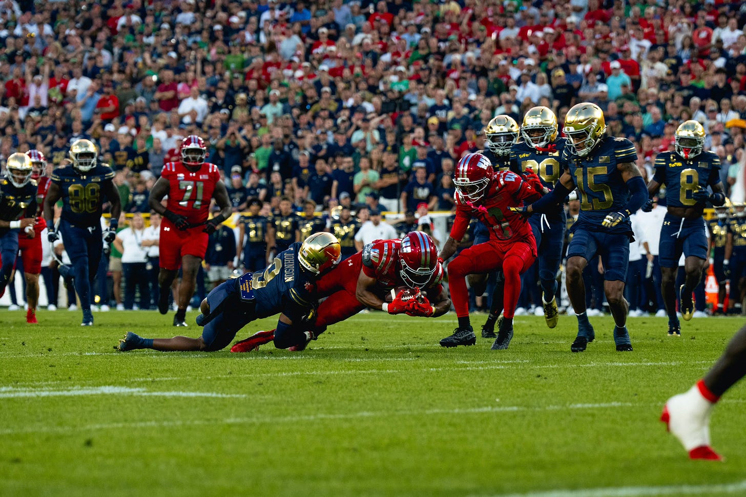 ImageWisconsin Badgers player is tackled by a Notre Dame defender during the Week 1 game at Lambeau Field. ImageWisconsin Badgers player is tackled by a Notre Dame defender during the Week 1 game at Lambeau Field.