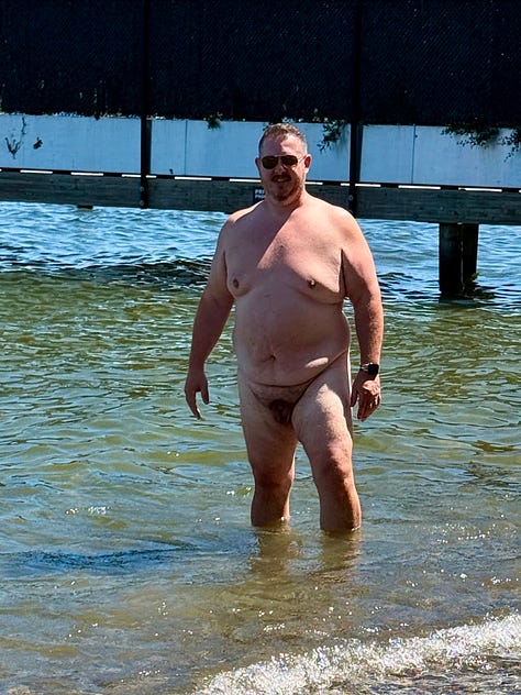 Albert and Anita swim among lily pads in the Netherlands; Dave stands nude on Baker Beach holding his dog with the Golden Gate Bridge in the distance; Jacob wades in at Denny Blaine; James walks out of the water wearing sunglasses; Craig stands naked at the helm of a boat under a red canopy.