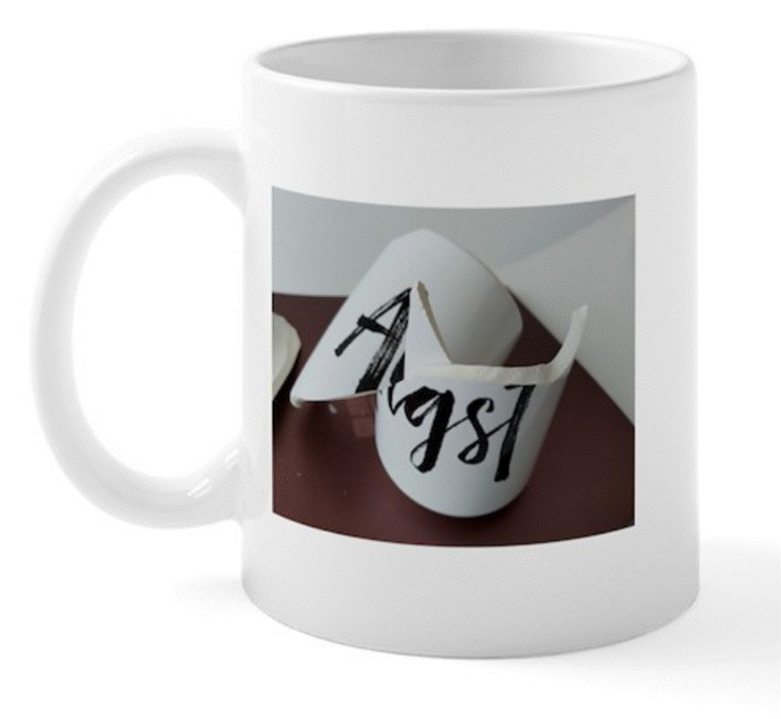 A white mug with a broken cup
Description automatically generated A white mug with a broken cup
Description automatically generated