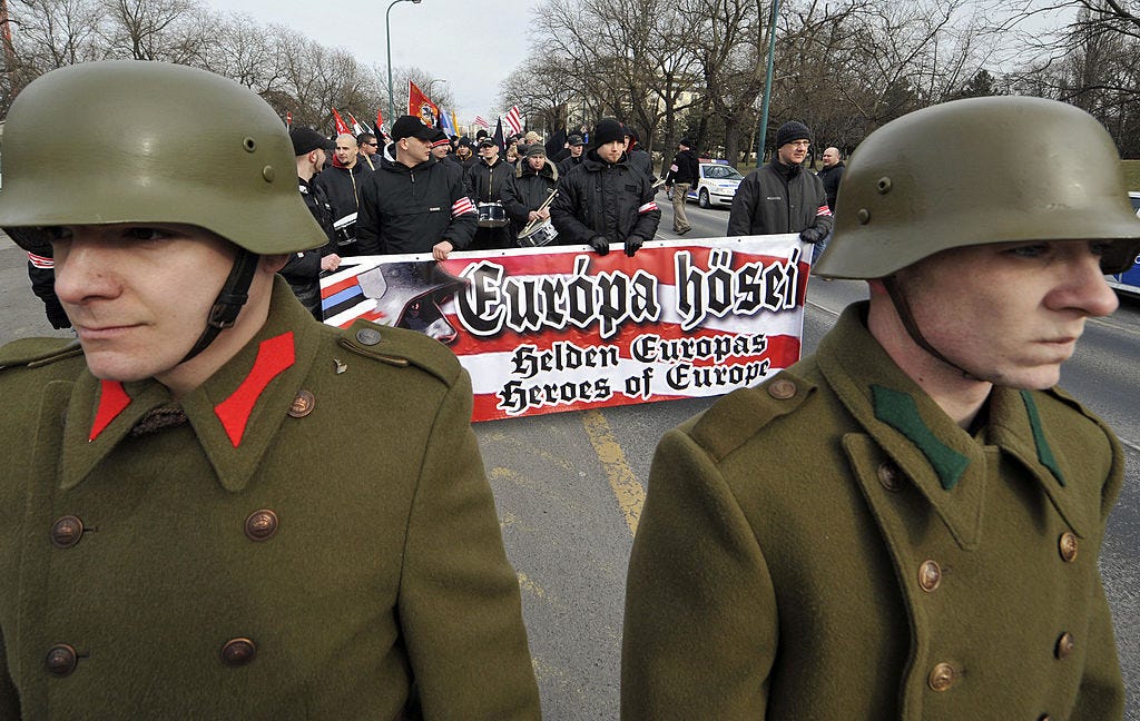A group of men in military uniforms

Description automatically generated