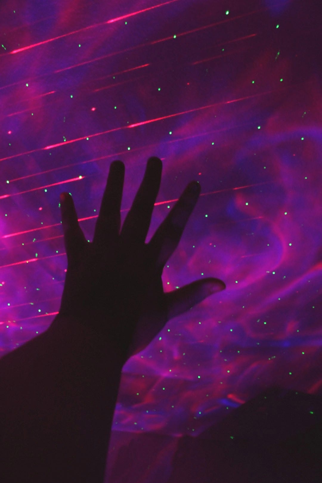 a person's hand in front of a bright light a person's hand in front of a bright light