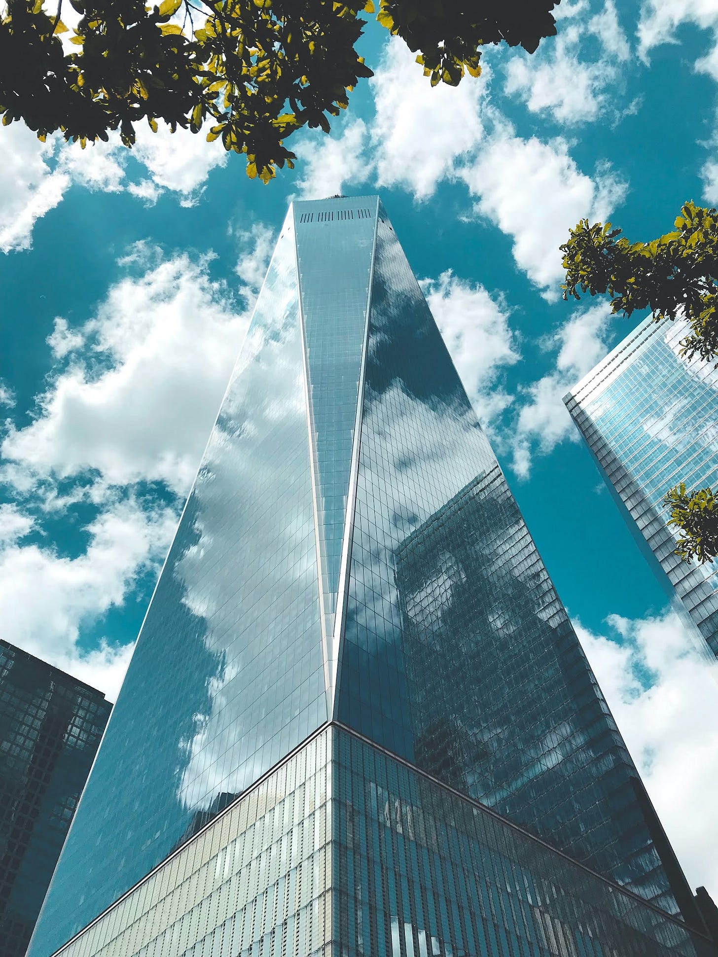 Tall corporate tower reflecting the sky