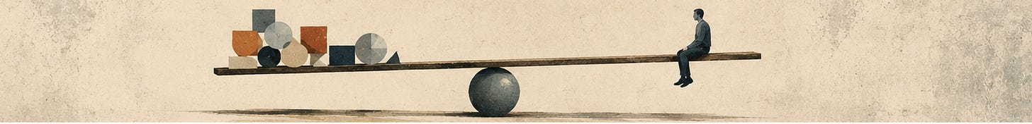 A man sits on one end of a seesaw balanced on a sphere, with stacked items and shapes on the other end.