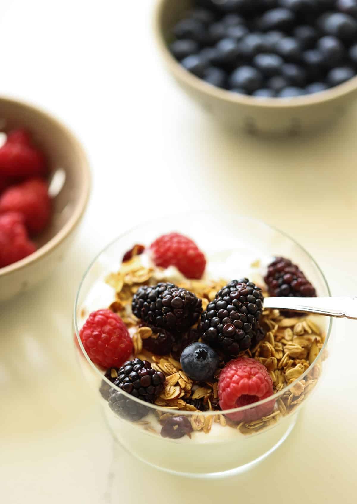 berries in bowl and a granola yogurt parfait recipe berries in bowl and a granola yogurt parfait recipe