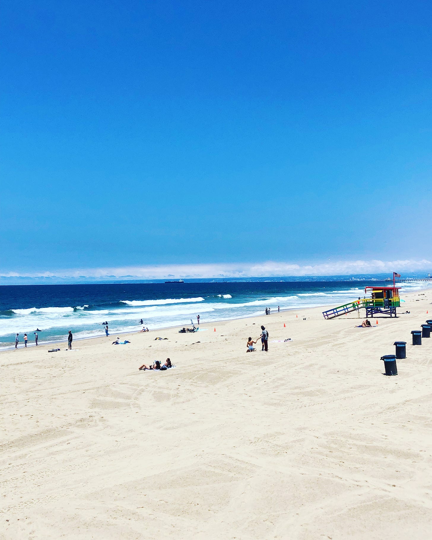 People on the sand at Hermosa Beach, California. 