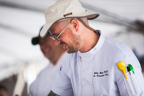 “Chefs from Aramark Collegiate Hospitality showcasing coastal-inspired dishes at the NC Seafood Festival 2025 — including seafood risotto, crab gumbo, and fried shrimp tacos — during live cooking demos and tastings with festival guests.”