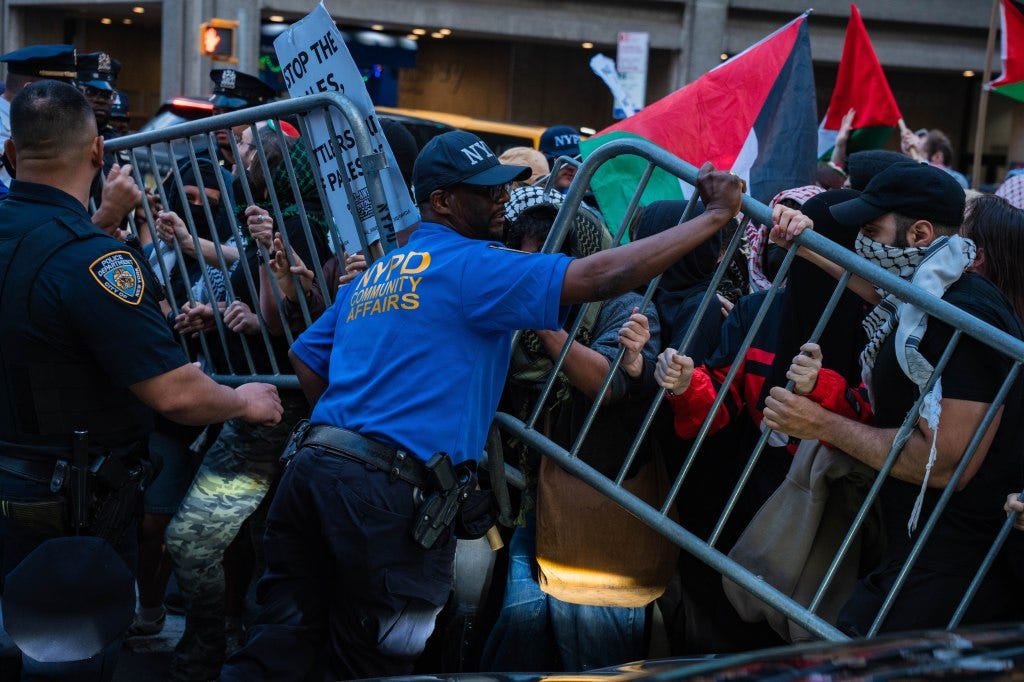 Police and antizionist protesters clash at a rally outside Park East Synagogue in New York.