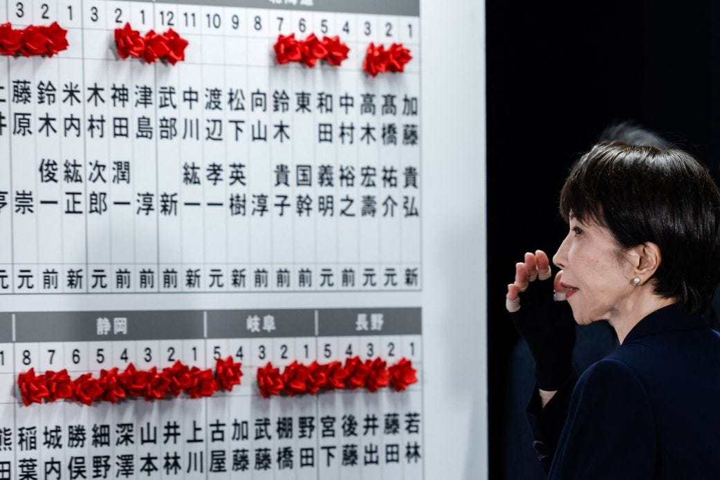 Japan's Prime Minister Sanae Takaichi gestures after speaking with media on the House of Representatives election day at her party headquarters in Tokyo, on February 8, 2026.