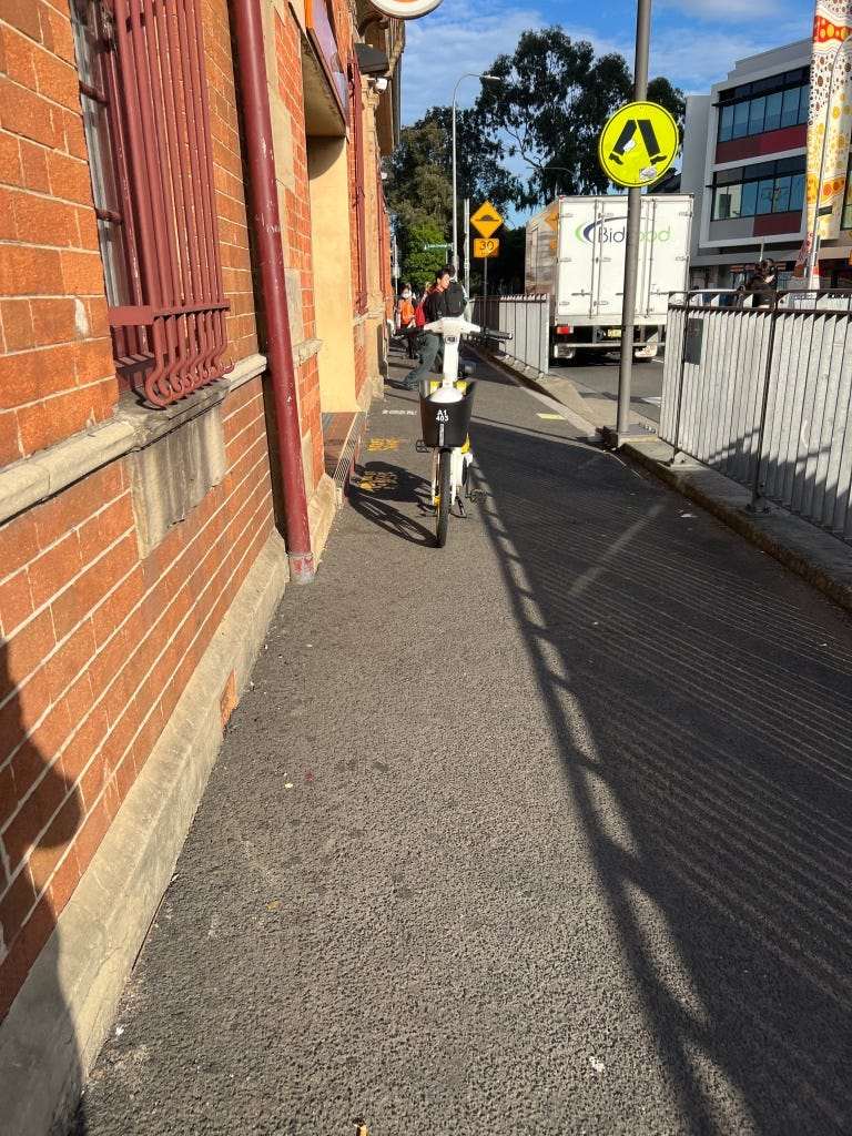 At Redfern Station, in front of the entrance.