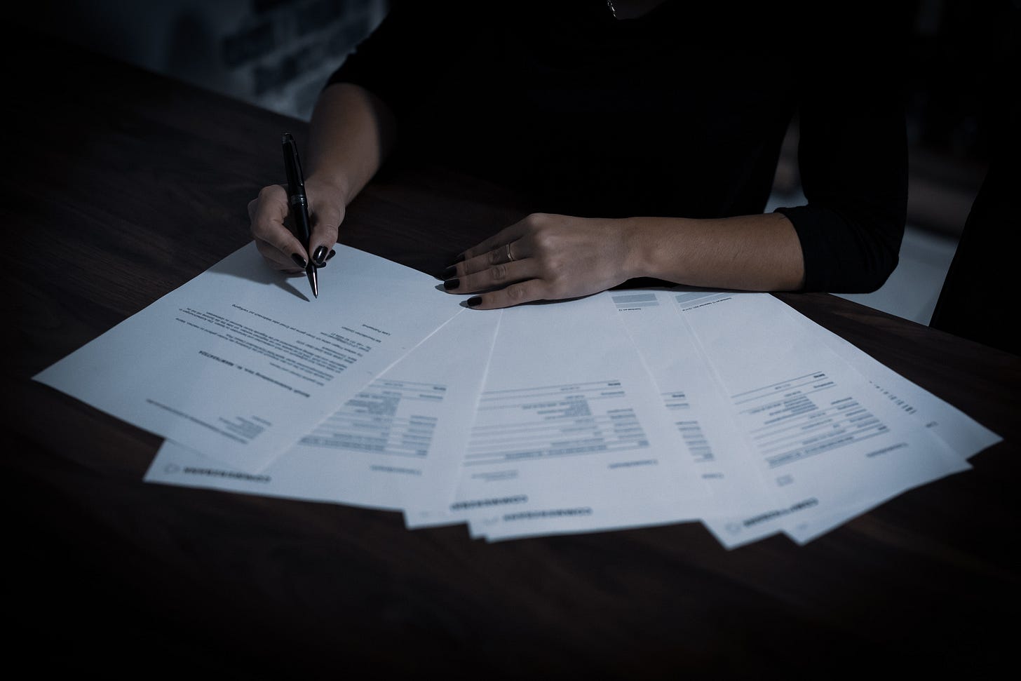 Woman signing documents