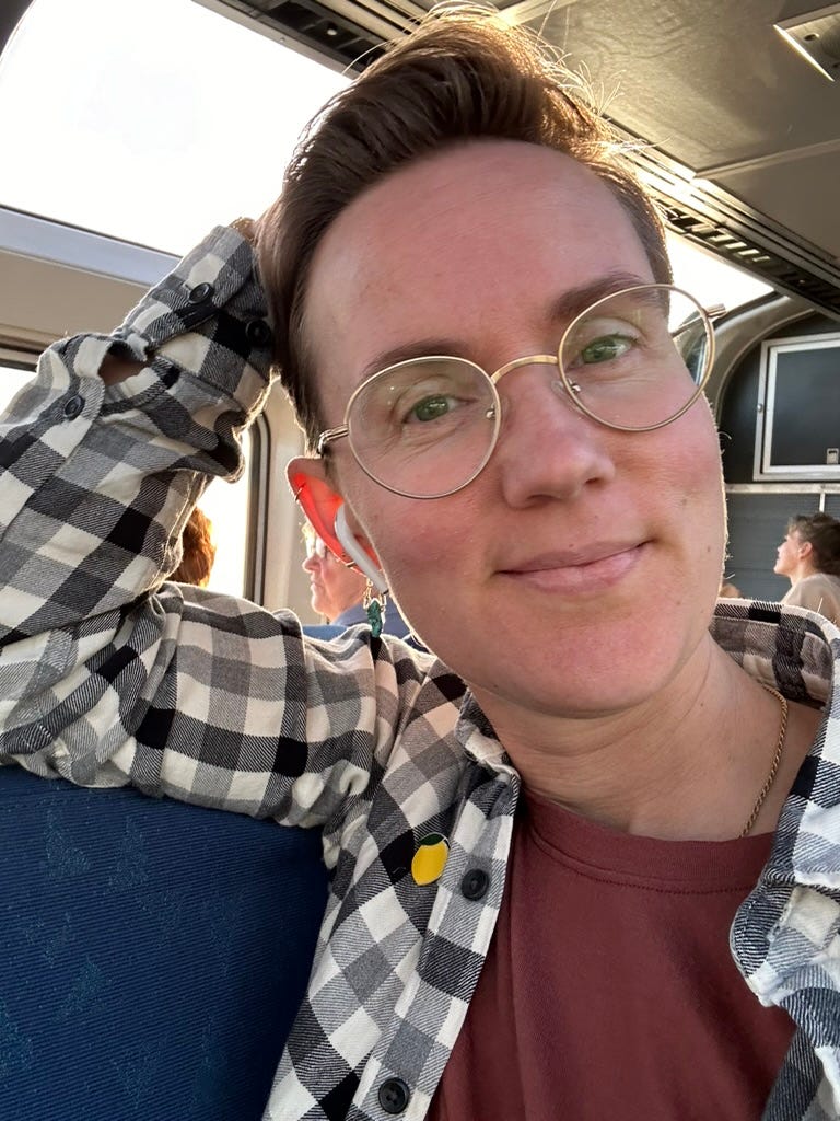 smiling woman on a train