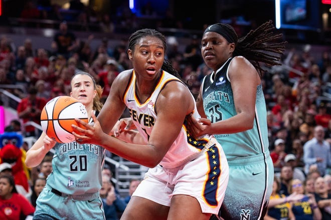 May 24, 2025; Indianapolis, Indiana, USA; Indiana Fever forward Aliyah Boston (7) shoots the ball while New York Liberty center Jonquel Jones (35) defends in the second half at Gainbridge Fieldhouse. Mandatory Credit: Trevor Ruszkowski-Imagn Images