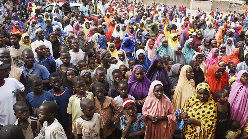 Internally displaced women and children gather at a camp in the Garga Village in Plateau state on April 12, 2022.