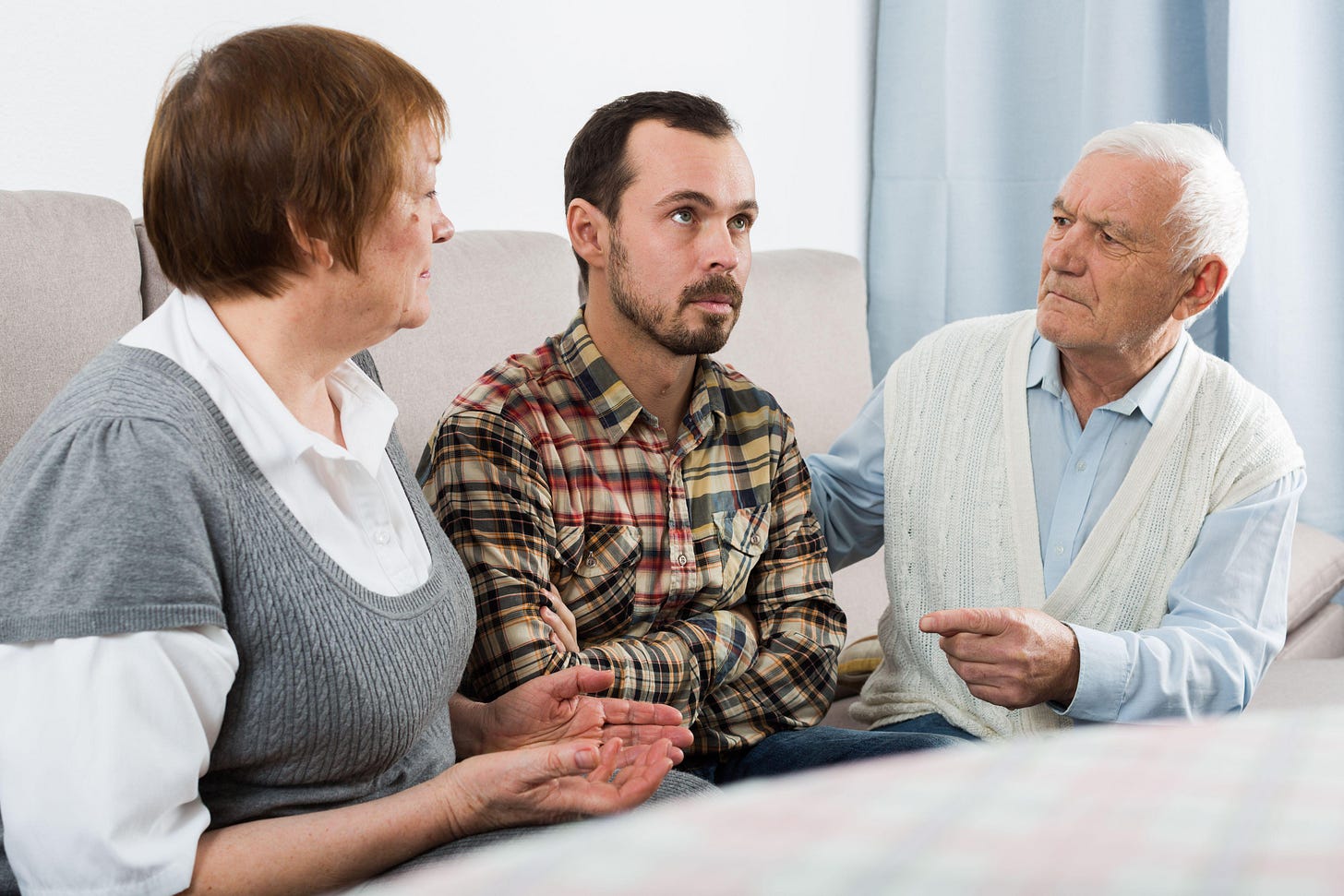 Parents arguing with son