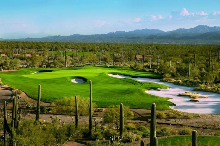 This may contain: an aerial view of a golf course surrounded by cacti and cactus trees with mountains in the background This may contain: an aerial view of a golf course surrounded by cacti and cactus trees with mountains in the background