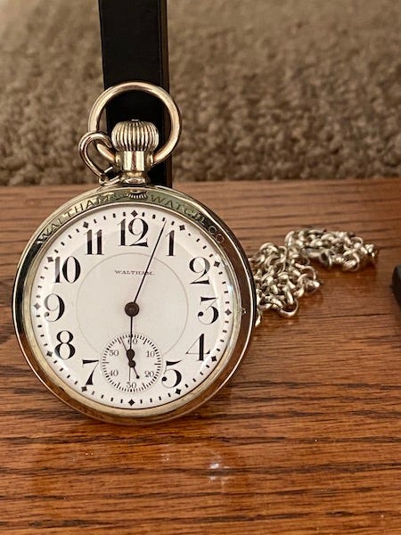 Waltham pocket watch on stairs