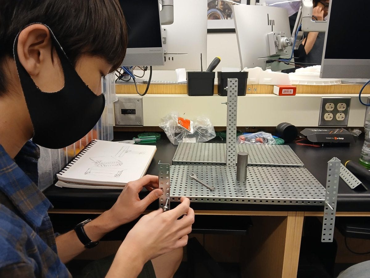 Electrical engineering major Benjamin Chun, 19, works on completing a robot based off the Karen Plankton robot character from the "Spongebob Squarepants" series during a Robotics Club meeting held on Friday, March 28, in the Industry and Technology Education Center. (Tina Talley | The Union)