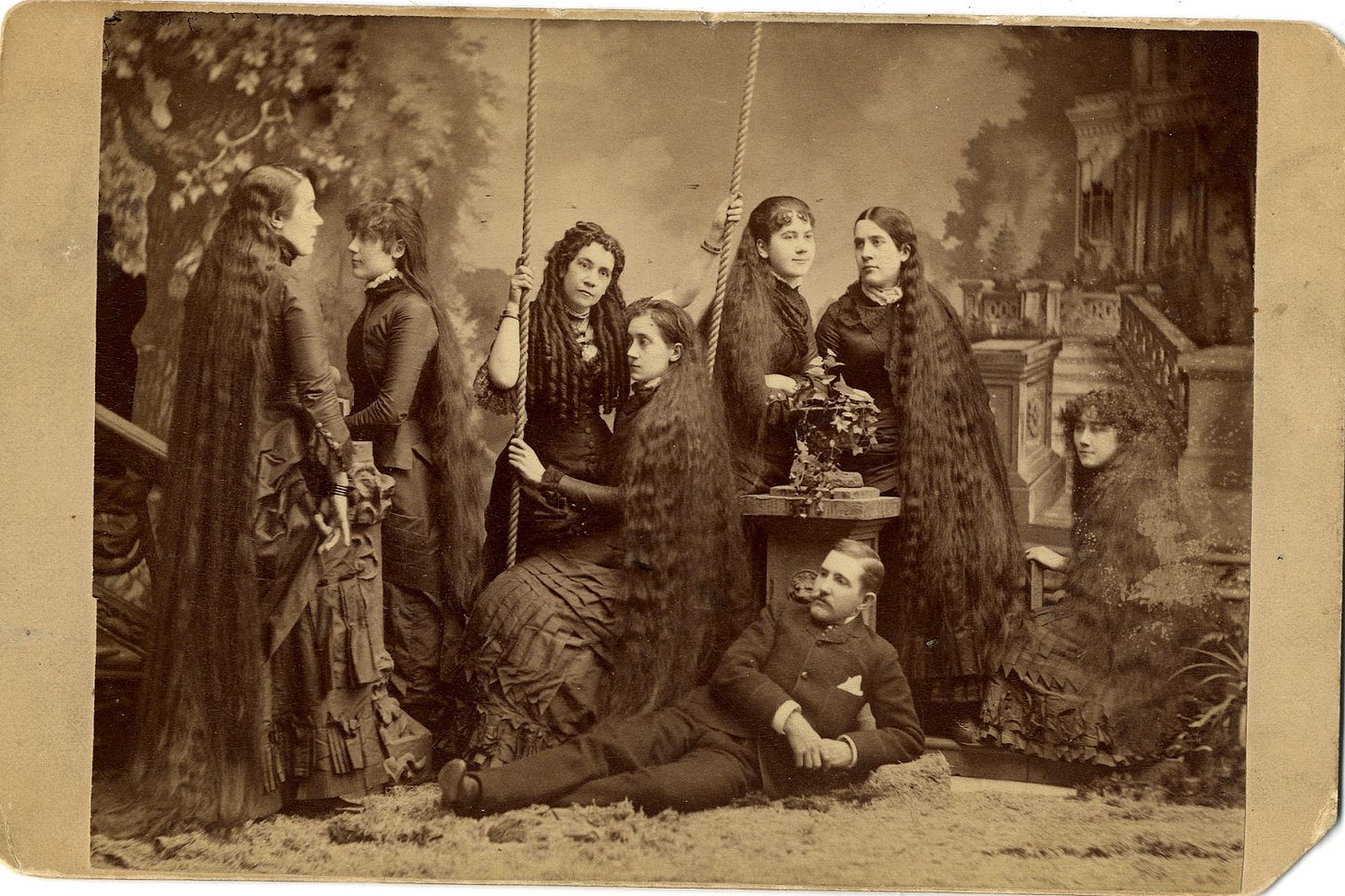 A group of women in a garment

Description automatically generated