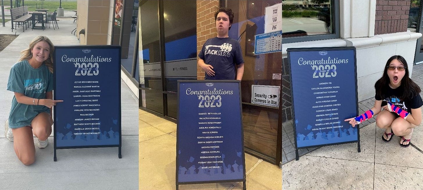 Three Coppell High School seniors with sandwich boards bearing their names