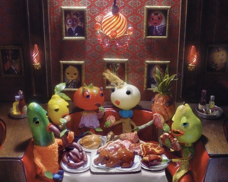 This may contain: a group of stuffed animals sitting around a table This may contain: a group of stuffed animals sitting around a table