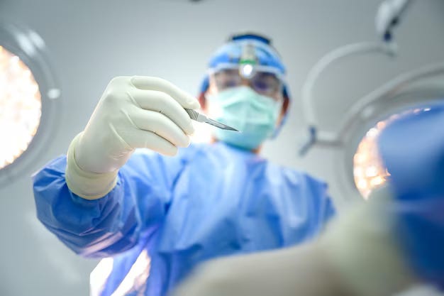 surgeon holding death blade in operating room link to source