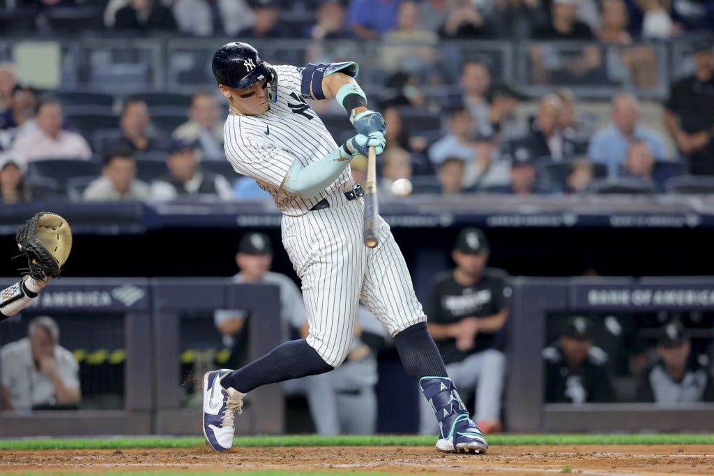New York Yankees right fielder Aaron Judge (99) hits a three run home run against the Chicago White Sox during the second inning at Yankee Stadium. The home run was his 50th of the season. 