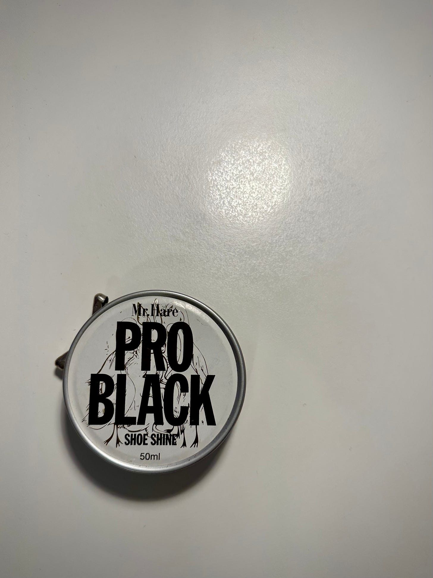 A round tin of PRO BLACK wax shoe polish from my much-loved and much-missed formal shoe company Mr. Hare, which its proprietor Marc Hare described as a shoe company “for men who were sartorial swans among geese”.