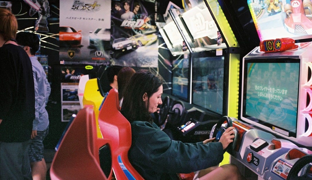 woman driving arcade machine