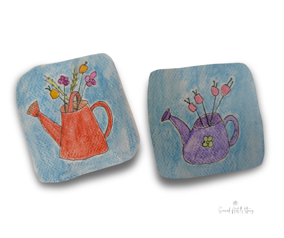 two small quirky paintings of watering cans with flowers. simple, hand drawn images and quite colorful