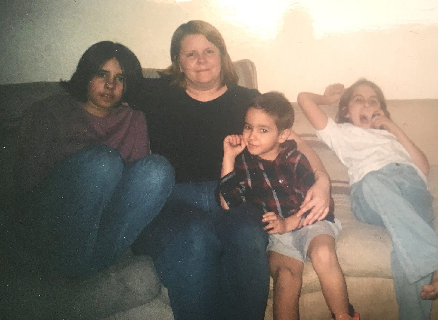 A young Rayan Semery-Palumbo with his mother and sisters on a couch at home in Arizona. A young Rayan Semery-Palumbo with his mother and sisters on a couch at home in Arizona.